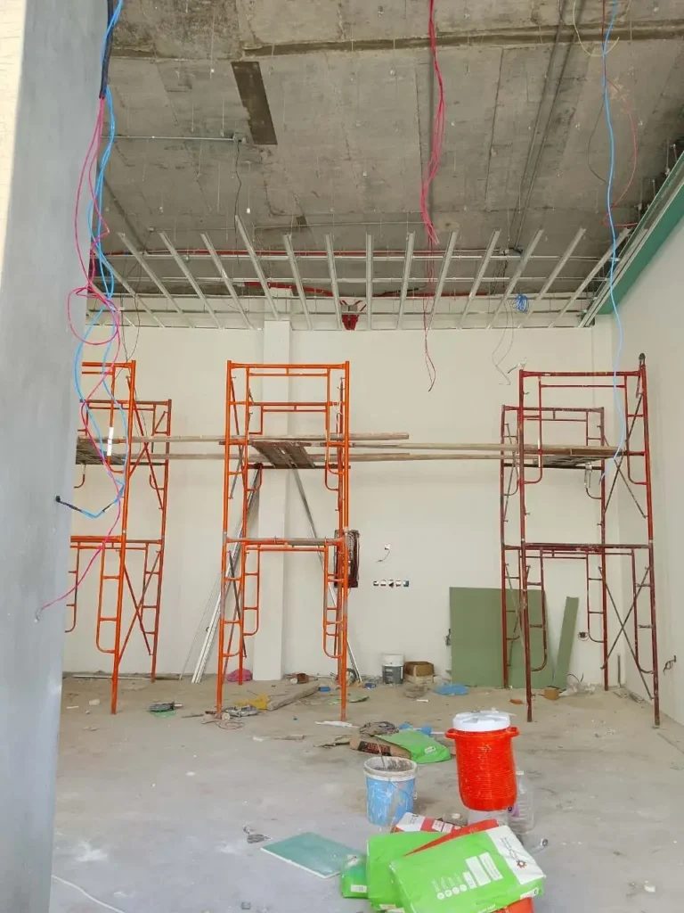 Interior construction site with scaffolding and ceiling work jpg 768x1024